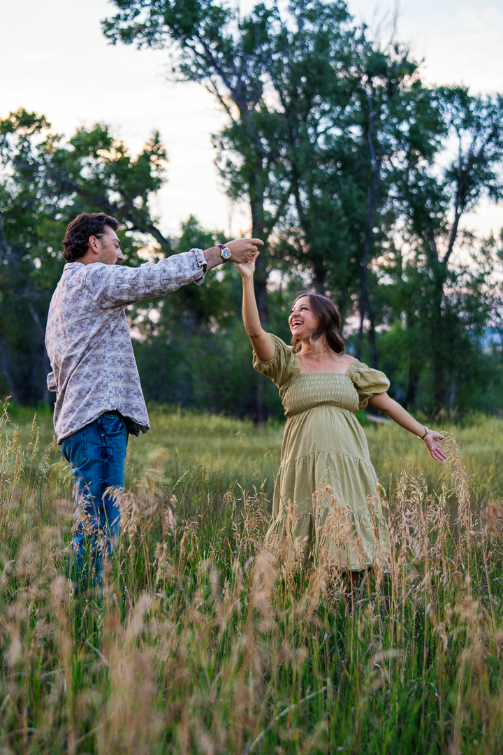 Couple's hands with engagement ring